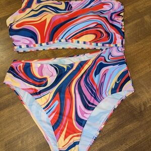 Vibrant Red and Blue One Piece with Artistic Swirls